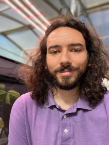 Max Ragozzino, ODA, Biocontrol Entomologist close up photo in greenhouse.